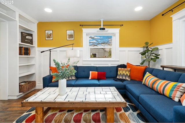 living room featuring recessed lighting, built in features, wood finished floors, and wainscoting