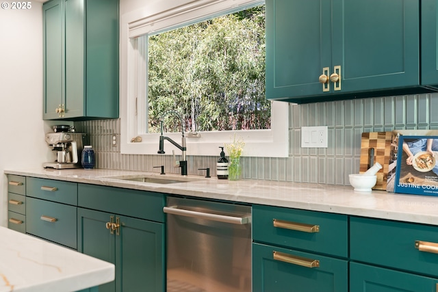5431 SW Alfred St, Portland, OR 97219 - kitchen featuring stainless steel dishwasher, decorative backsplash, a sink, and light stone counters