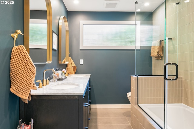5431 SW Alfred St, Portland, OR 97219 - full bathroom featuring double vanity, tile patterned flooring, toilet, and tiled shower / bath combo