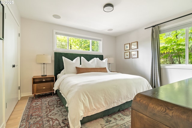 5431 SW Alfred St, Portland, OR 97219 - bedroom with multiple windows and light wood finished floors