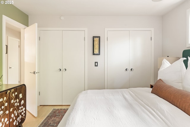5431 SW Alfred St, Portland, OR 97219 - bedroom with two closets and light wood-type flooring