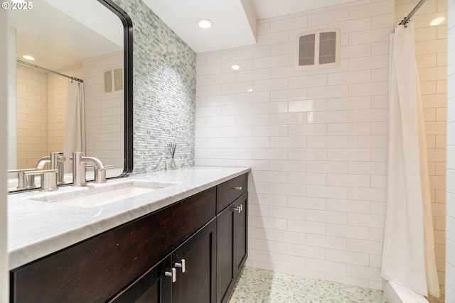 5431 SW Alfred St, Portland, OR 97219 - bathroom with vanity, tile walls, tiled shower, and recessed lighting
