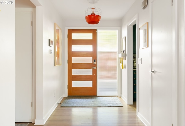 5431 SW Alfred St, Portland, OR 97219 - foyer with light wood-style floors and baseboards
