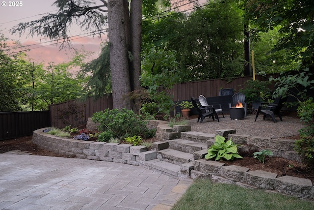 5431 SW Alfred St, Portland, OR 97219 - fenced backyard with a fire pit and a patio area