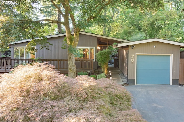 5431 SW Alfred St, Portland, OR 97219 - mid-century home featuring driveway, a garage, and a deck