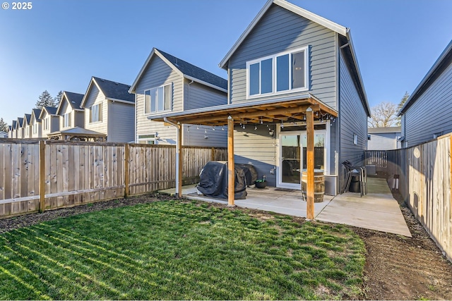 back of property featuring a patio area and a lawn