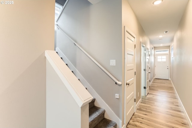 hall with light hardwood / wood-style floors