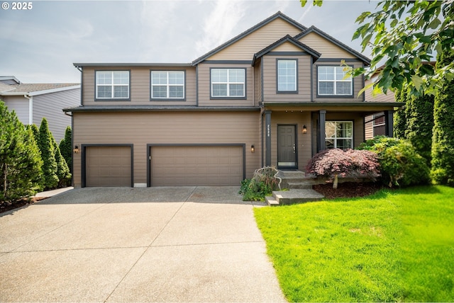 2530 NW 22nd Ave, Camas, WA 98607 - view of front of home featuring an attached garage, concrete driveway, and a front lawn