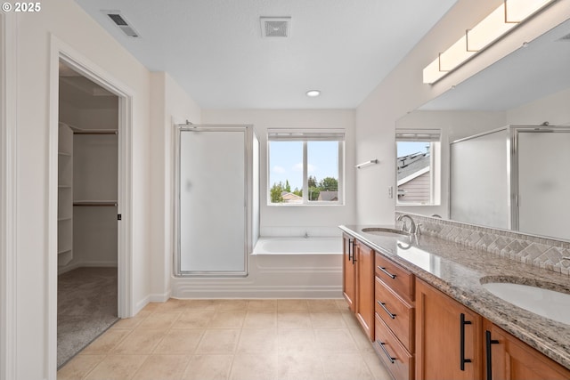 2530 NW 22nd Ave, Camas, WA 98607 - full bath featuring a stall shower, a bath, double vanity, a spacious closet, and recessed lighting