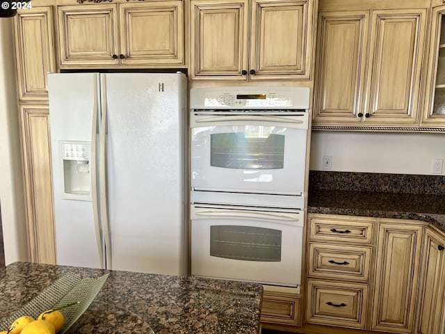 98694 Woodriff Ln, Brookings, OR 97415 - kitchen featuring white appliances, dark stone counters, and glass insert cabinets