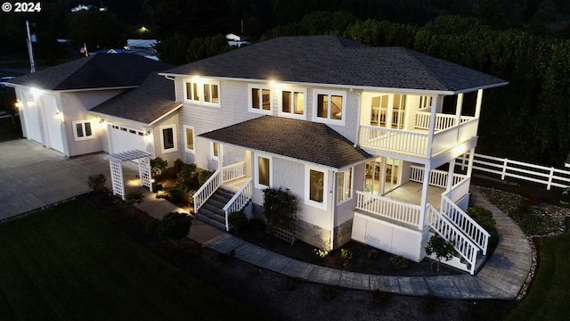 98694 Woodriff Ln, Brookings, OR 97415 - rear view of property with fence, concrete driveway, stairway, a balcony, and roof with shingles