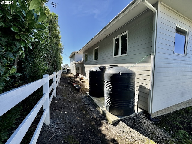 98694 Woodriff Ln, Brookings, OR 97415 - view of side of property featuring central air condition unit and fence