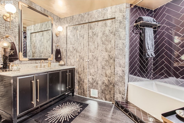 1420 NW Lovejoy St Unit 327, Portland, OR 97209 - full bath with vanity, a tub to relax in, wood finished floors, and a shower