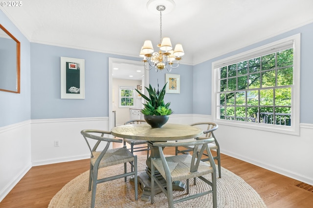 6611 SE 40th Ave, Portland, OR 97202 - dining area featuring a chandelier and wood finished floors