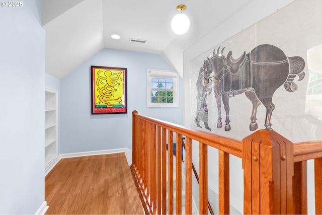 6611 SE 40th Ave, Portland, OR 97202 - hall featuring lofted ceiling, wood finished floors, and an upstairs landing