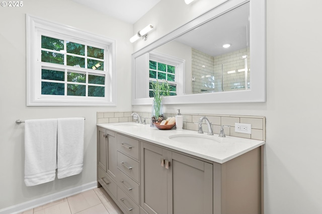 6611 SE 40th Ave, Portland, OR 97202 - full bathroom featuring double vanity, tiled shower, tile patterned flooring, and decorative backsplash