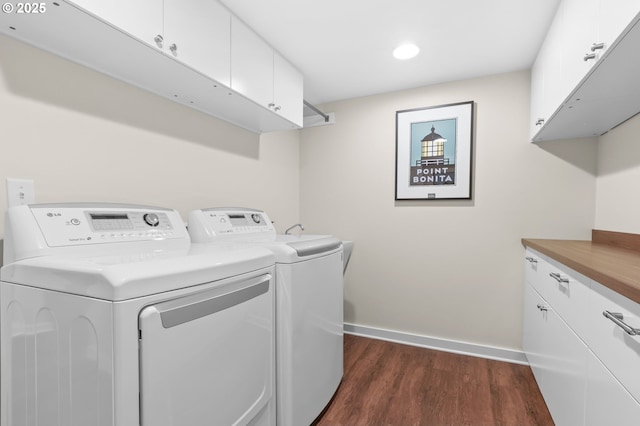6611 SE 40th Ave, Portland, OR 97202 - laundry area with cabinet space, washing machine and clothes dryer, dark wood-type flooring, and recessed lighting