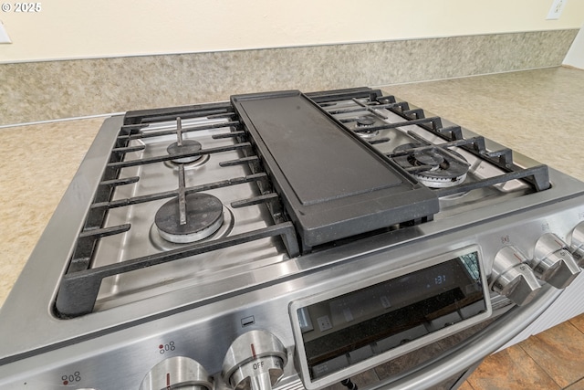 6120 SW Cross Creek Dr, Beaverton, OR 97078 - kitchen view of stainless steel gas stove and decorative backsplash