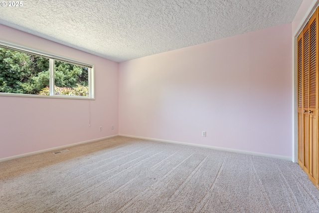 6120 SW Cross Creek Dr, Beaverton, OR 97078 - unfurnished bedroom with carpet, a textured ceiling, and a closet