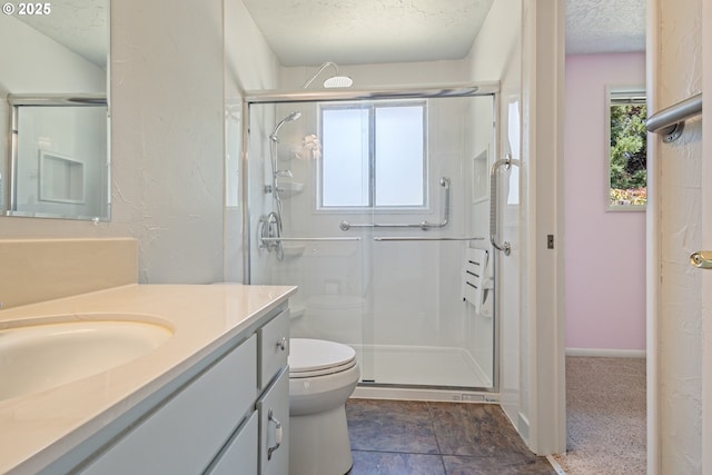 6120 SW Cross Creek Dr, Beaverton, OR 97078 - full bathroom with a shower stall, vanity, a textured ceiling, and stone finish flooring
