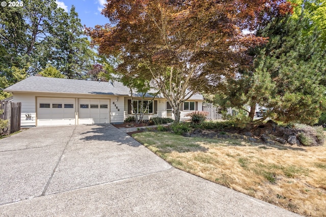 6120 SW Cross Creek Dr, Beaverton, OR 97078 - view of front of home with driveway, a garage, and a front lawn