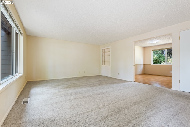 6120 SW Cross Creek Dr, Beaverton, OR 97078 - carpeted spare room with a textured ceiling and baseboards