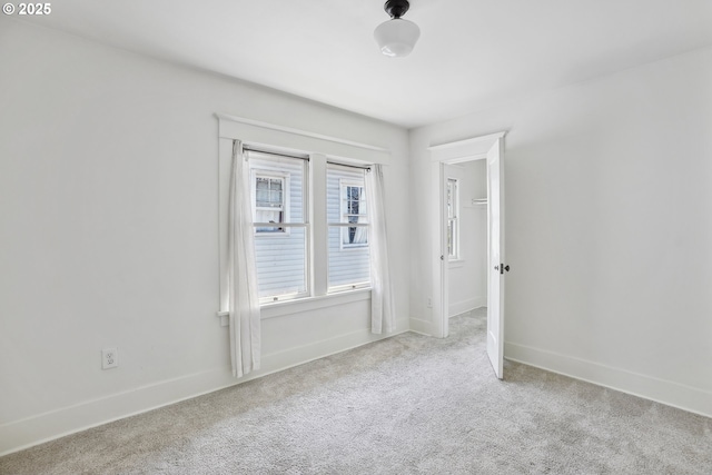 5025 NE 6th Ave, Portland, OR 97211 - spare room featuring carpet flooring and baseboards