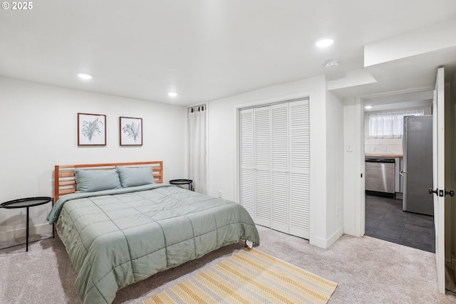 5025 NE 6th Ave, Portland, OR 97211 - carpeted bedroom with freestanding refrigerator, recessed lighting, a closet, and baseboards