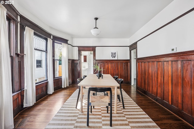 5025 NE 6th Ave, Portland, OR 97211 - dining space with a wainscoted wall and dark wood-type flooring