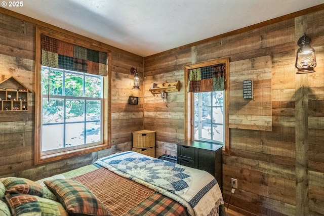 241 Jackson Rd, Cook, WA 98605 - bedroom featuring wood walls and multiple windows