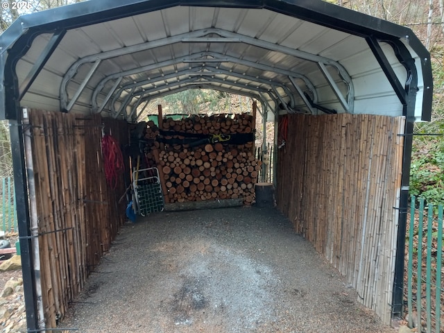 view of parking / parking lot featuring a carport