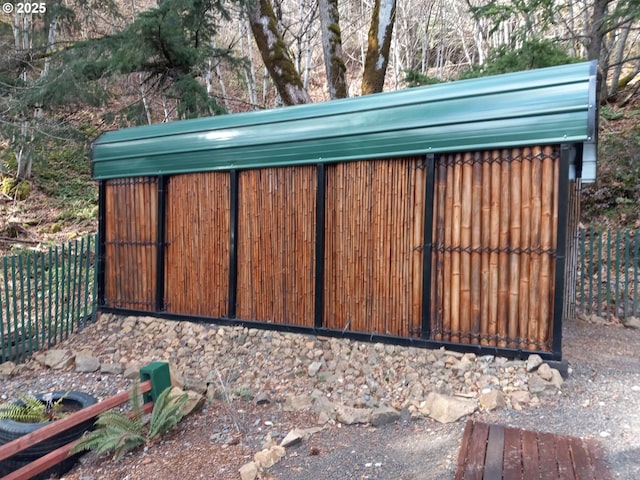 view of gate with fence