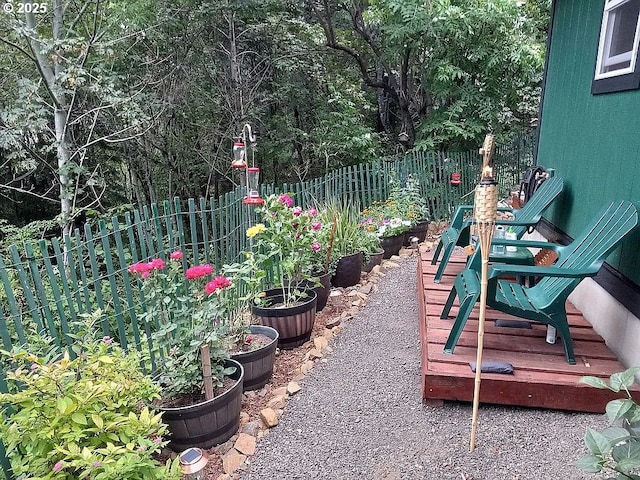 view of yard featuring a garden and a fenced backyard