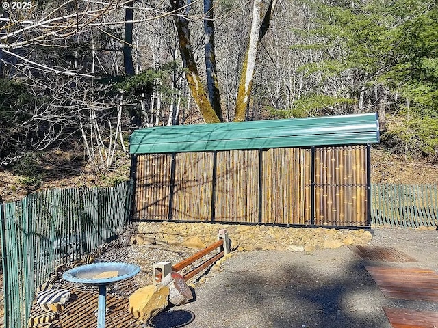 view of outdoor structure featuring fence