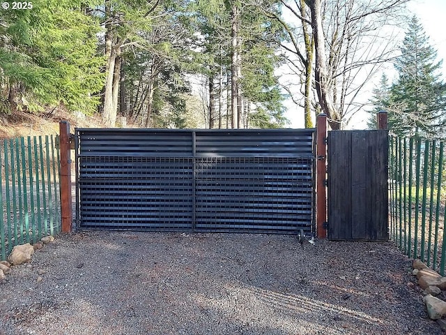 view of gate with fence