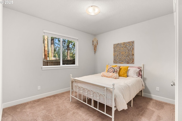 carpeted bedroom with a textured ceiling