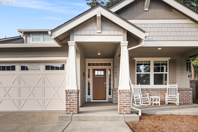 view of front of house featuring a porch and a garage