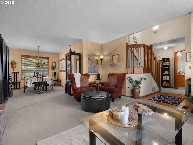 67 NW Orchard Pl, Gresham, OR 97030 - living room with a chandelier, light colored carpet, a textured ceiling, stairway, and baseboards