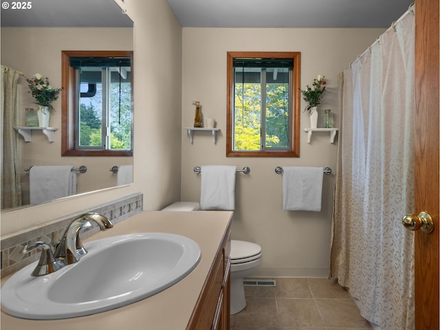 67 NW Orchard Pl, Gresham, OR 97030 - bathroom featuring healthy amount of natural light, toilet, tile patterned flooring, and vanity