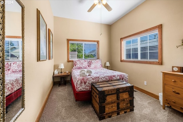 bedroom with a ceiling fan, light carpet, and baseboards