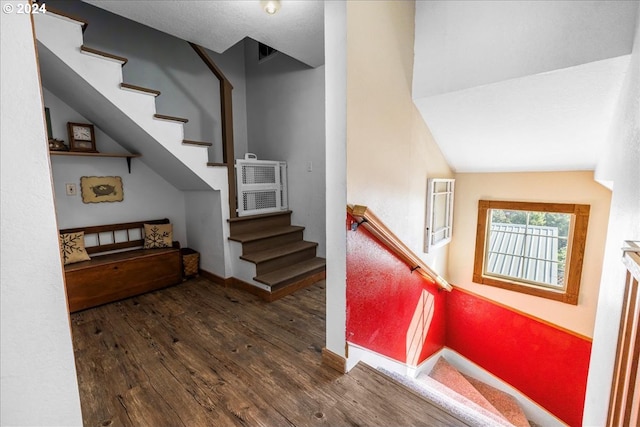 stairway with baseboards and wood finished floors