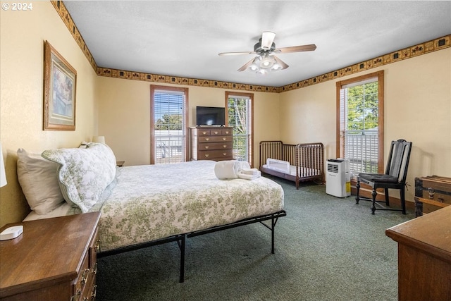 bedroom with ceiling fan and carpet floors