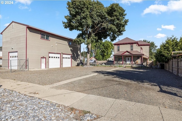 exterior space with a garage and fence