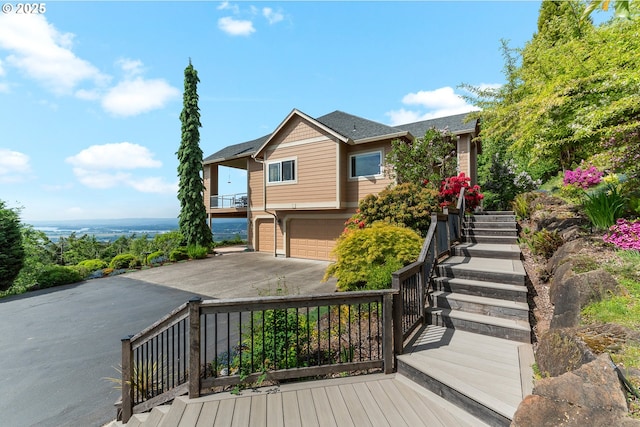 335 Runyan Rd, Woodland, WA 98674 - view of front of property with a garage, stairs, asphalt driveway, and roof with shingles