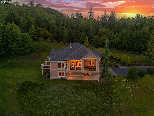 335 Runyan Rd, Woodland, WA 98674 - rear view of property with a patio, a lawn, a wooded view, and a wooden deck