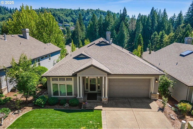 626 SE 38th Dr, Gresham, OR 97080 - view of front of house featuring an attached garage, concrete driveway, roof with shingles, a chimney, and a front lawn