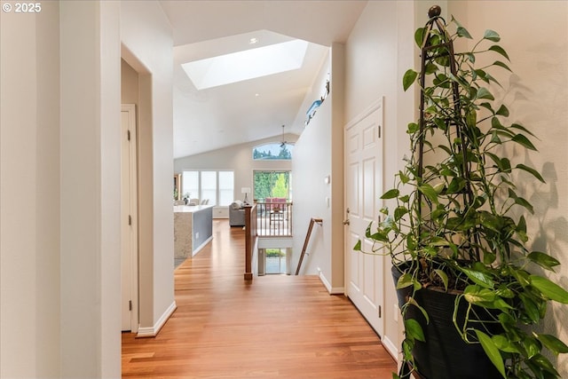 626 SE 38th Dr, Gresham, OR 97080 - hallway with a skylight, light wood finished floors, lofted ceiling, and an upstairs landing