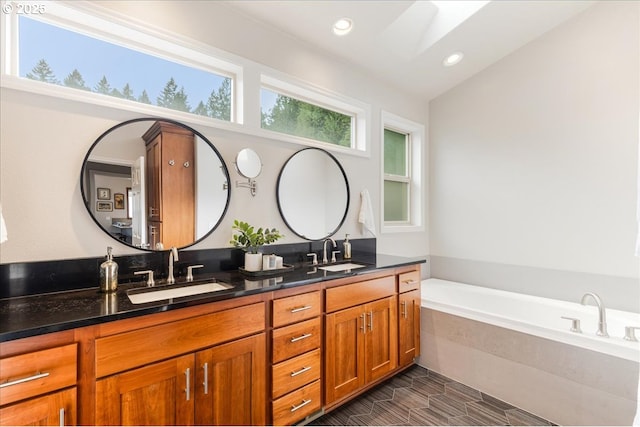 626 SE 38th Dr, Gresham, OR 97080 - bathroom featuring double vanity, a bath, and recessed lighting