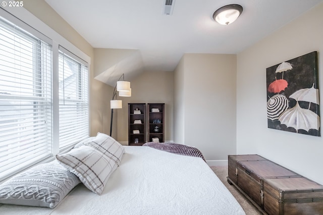 bedroom featuring visible vents, baseboards, and carpet floors