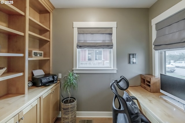 office featuring visible vents and baseboards